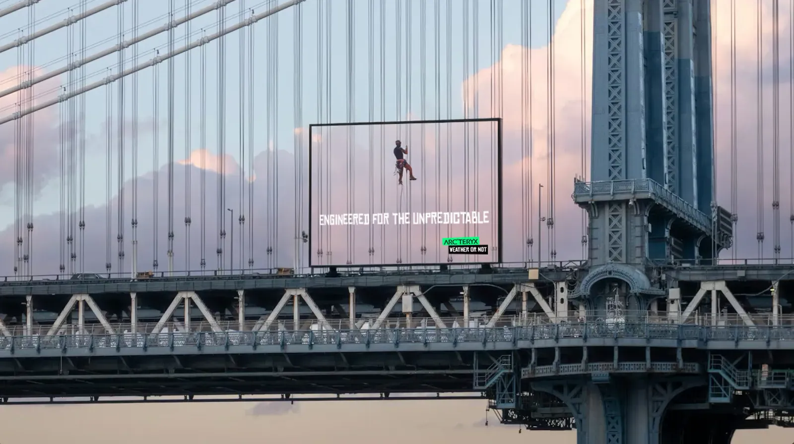 An Arc'teryx board on a city bridge.