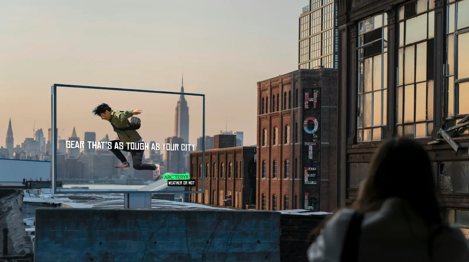 A rooftop board above the city at dusk.